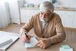 close-up-senior-person-while-learning_23-2149072426